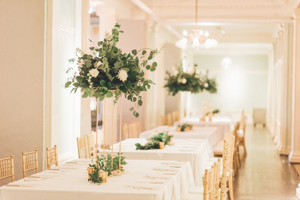white wedding reception tables with gold chiavari chairs