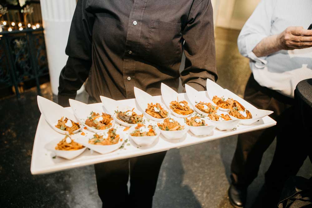 Caterer passing out hors d'oeuvres at a reception