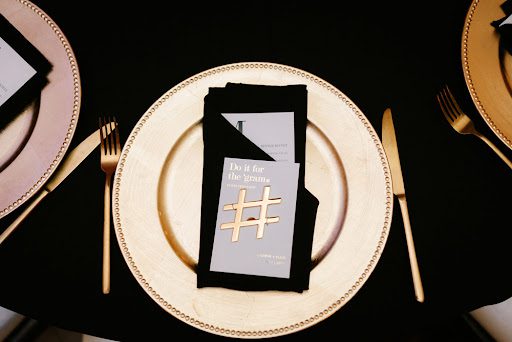 Wedding table setting with wedding hashtag napkin