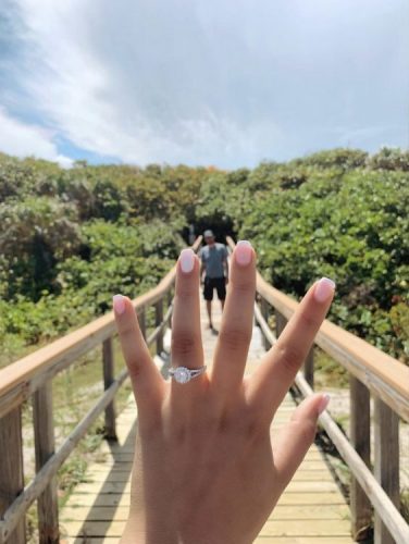 A Lightner Museum bride shows off her diamond engagement ring after her proposal.