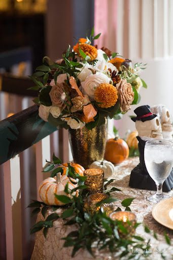 Table decorations at Kim and Rockwell's October wedding