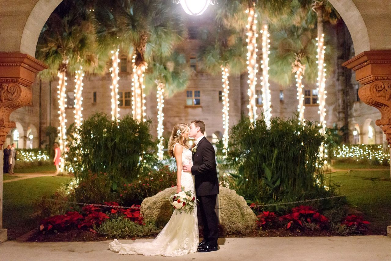 Morgan and Ryan kiss outside in the Lightner Museum courtyard