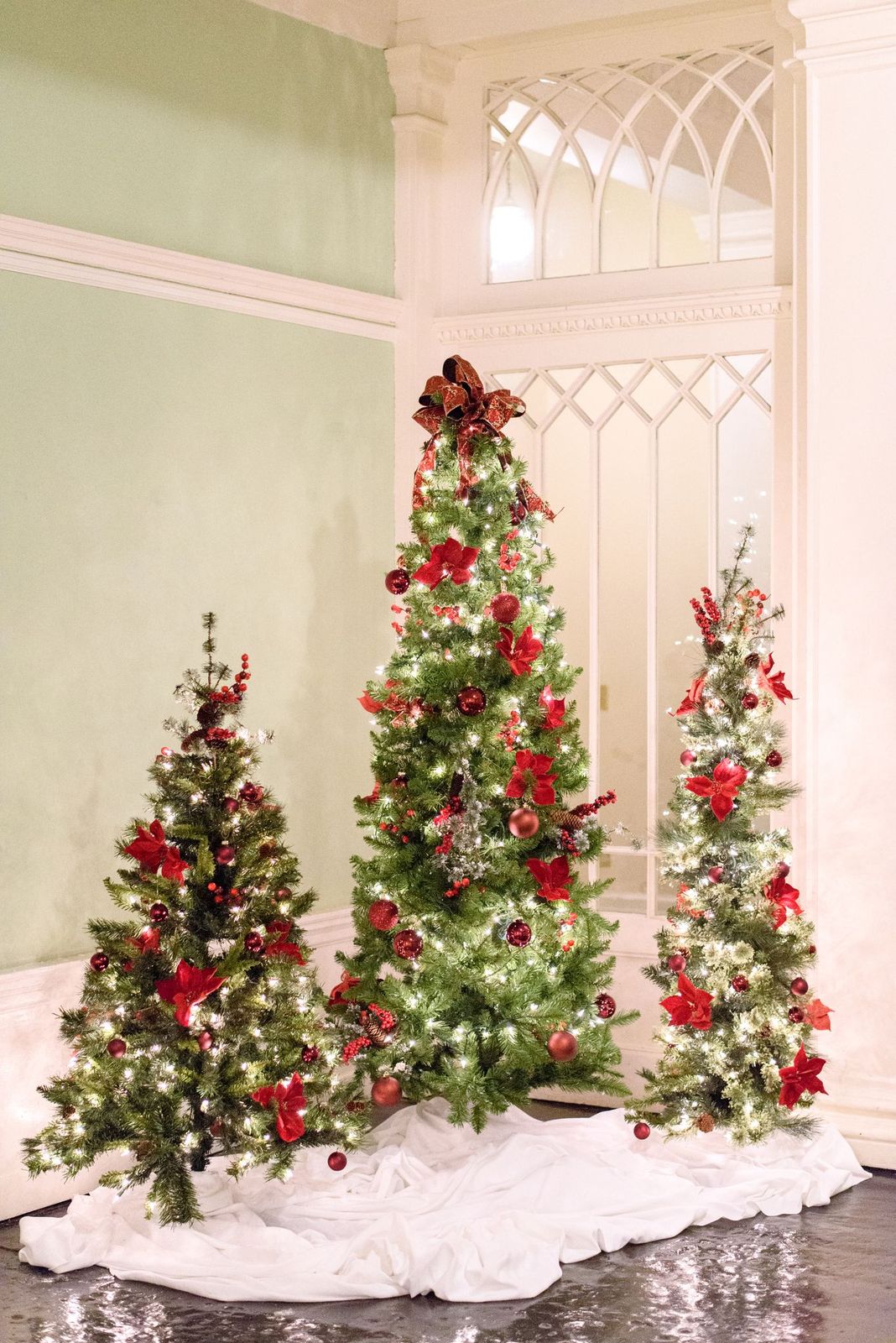 Christmas trees decorated with red ornaments for winter wedding