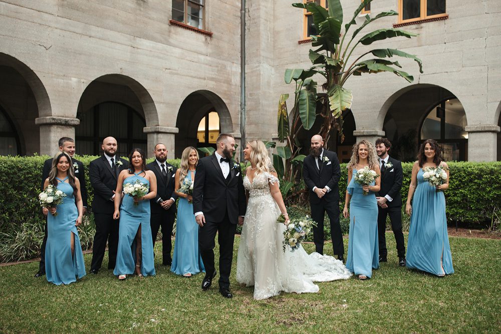 Bride and groom and wedding party on the Lightner Museum grounds
