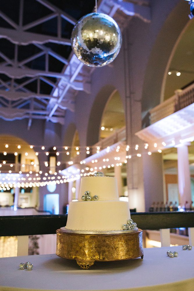 Wedding cake table under a disco ball