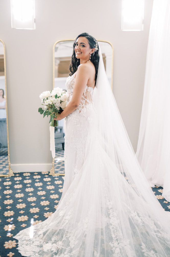 Bride posing in the bridal suite