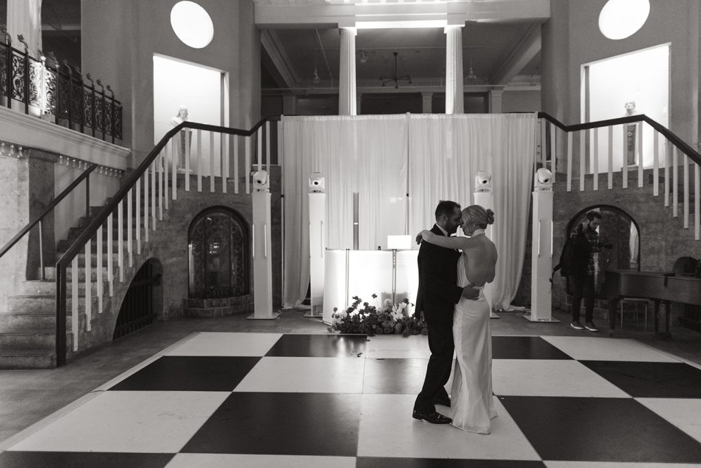 black and white photo of bride and groom's private last dance