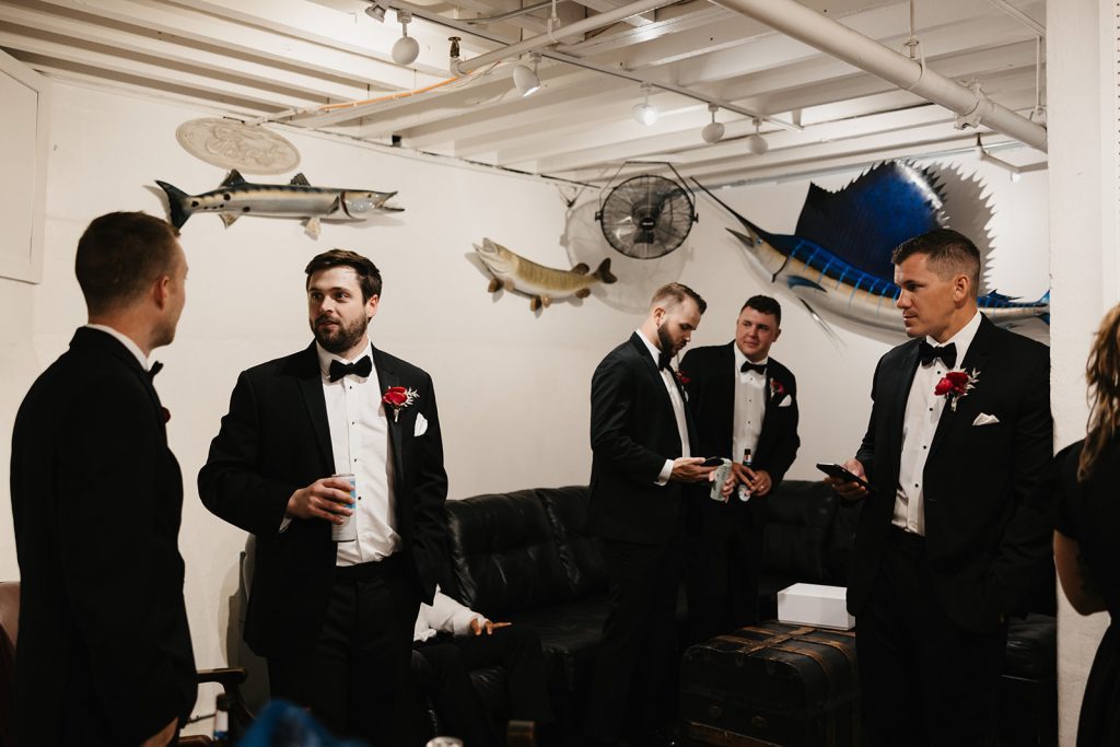 Groom and groomsmen hanging out in the Otto Lightner Lounge
