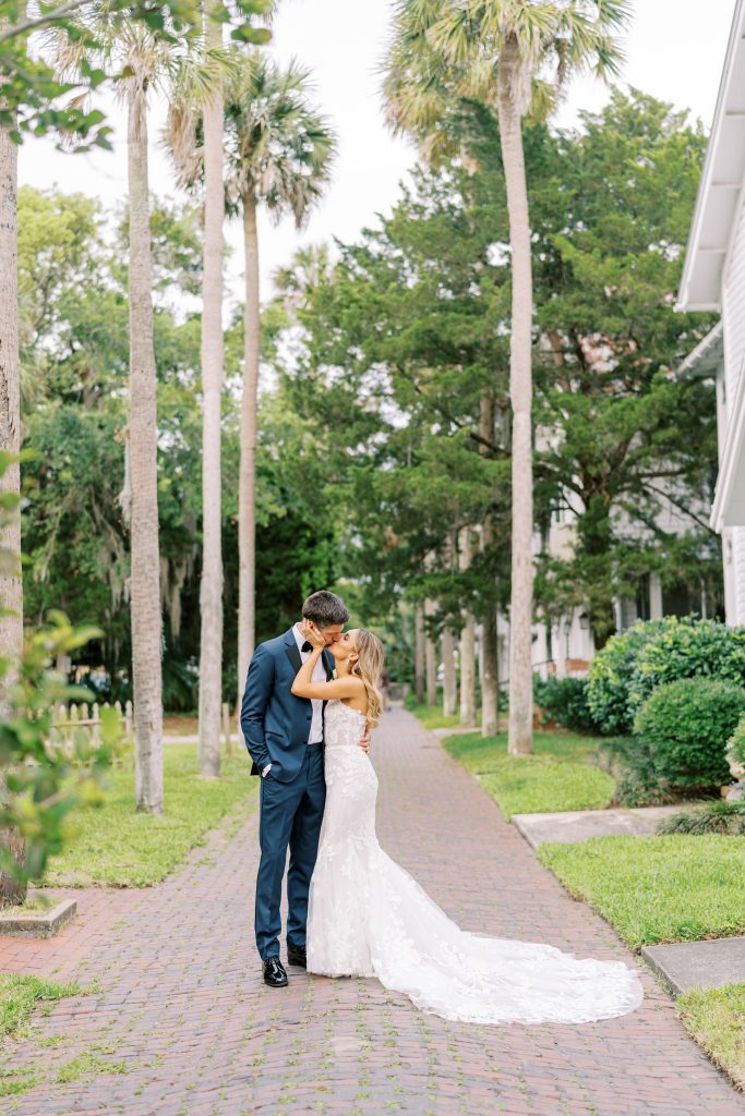 bride and groom kissing on Palm Row in St. Augustine