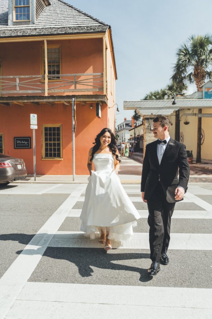 Bride and groom walking down Aviles Street in St. Augustine