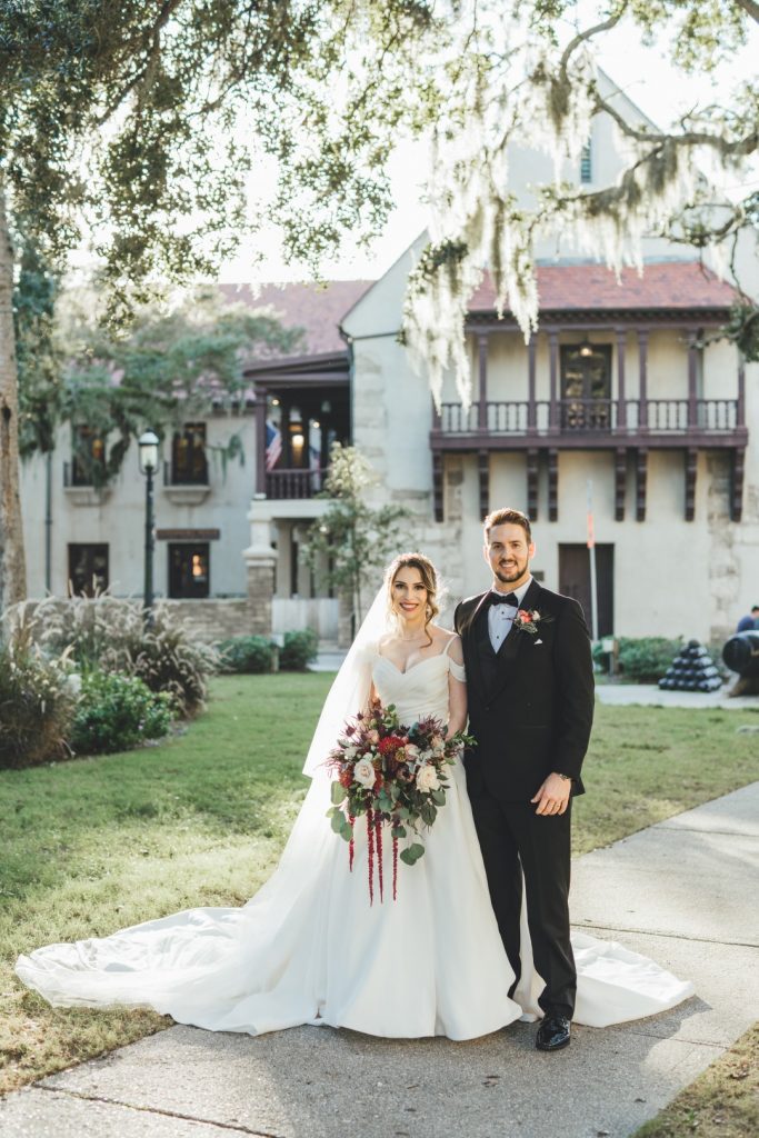 Bride and groom in front of the historic Governor's House in St. Augustine