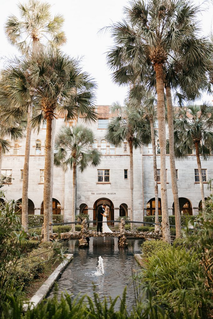 bride and groom in the central courtyard at Lightner Museum